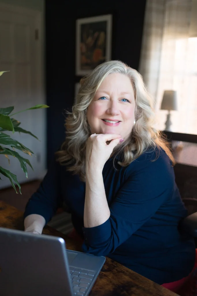 Kate Bergman, LISW-S, smiling at her desk